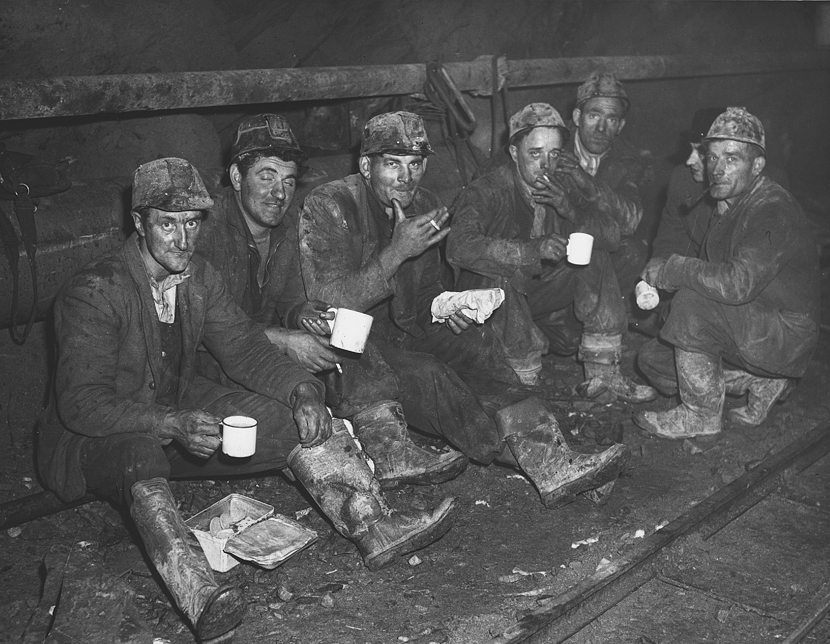 Tunnel workers taking a break from their work on one of the hydro-electric schemes in Scotland in the mid-twentieth century. (Image courtesy of SSE Renewables)