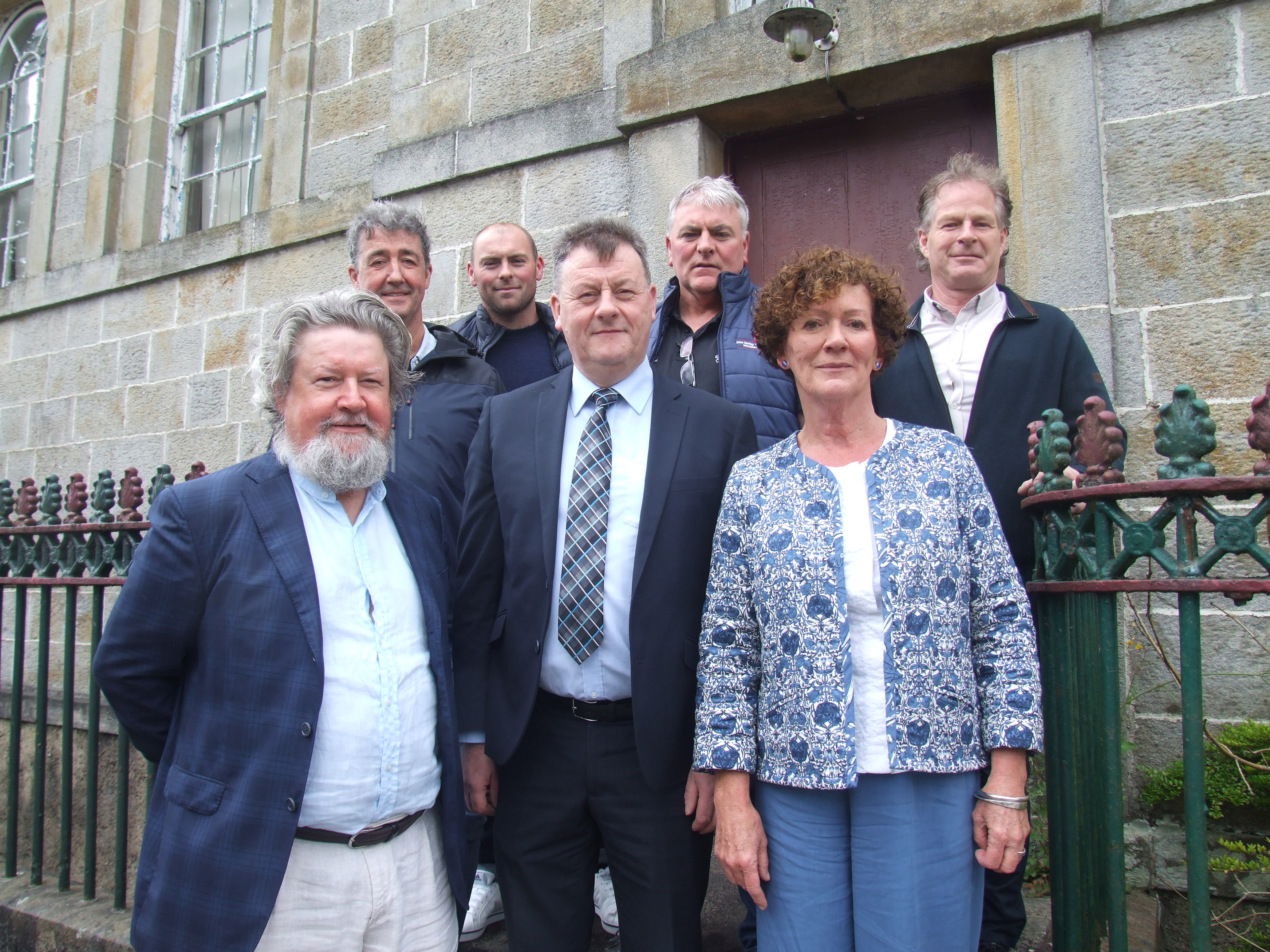 Pictured outside mid-nineteenth century Glenties Courthouse are members of the Brian Friel Trust with building contractors (from left to right): Front row - Denis Conway, Seamus Neely & Mary Friel Bateman. Back row - Bradas O’Donnell, Dermot Molloy, John Molloy & Michael Gallagher.  