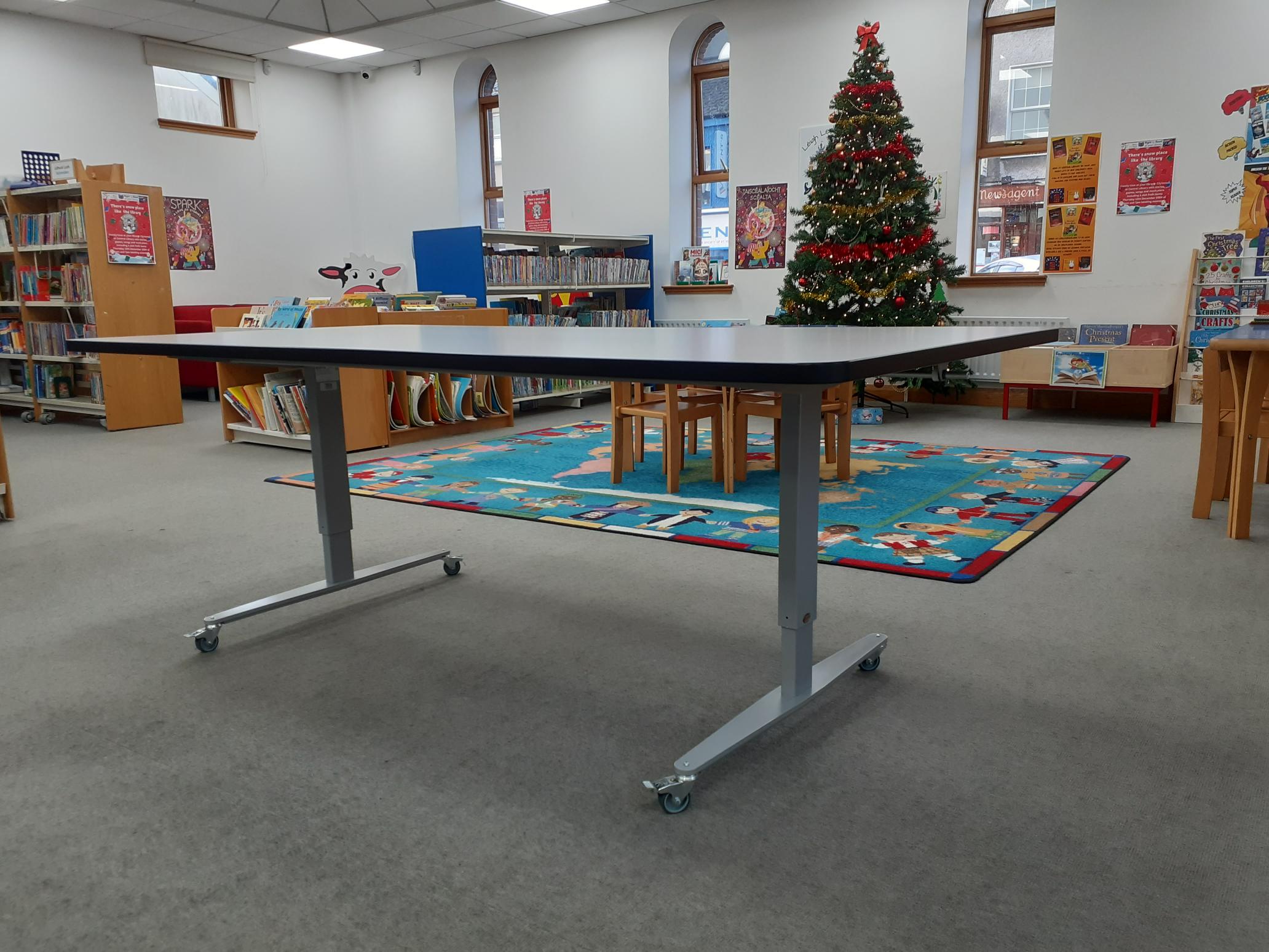 Wheelchair accessible height adjustable table pictured at Central Library. 